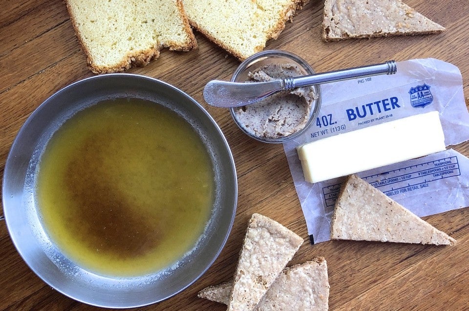 Brown butter melted in a skillet surrounded by pound cake and shortbread wedges.